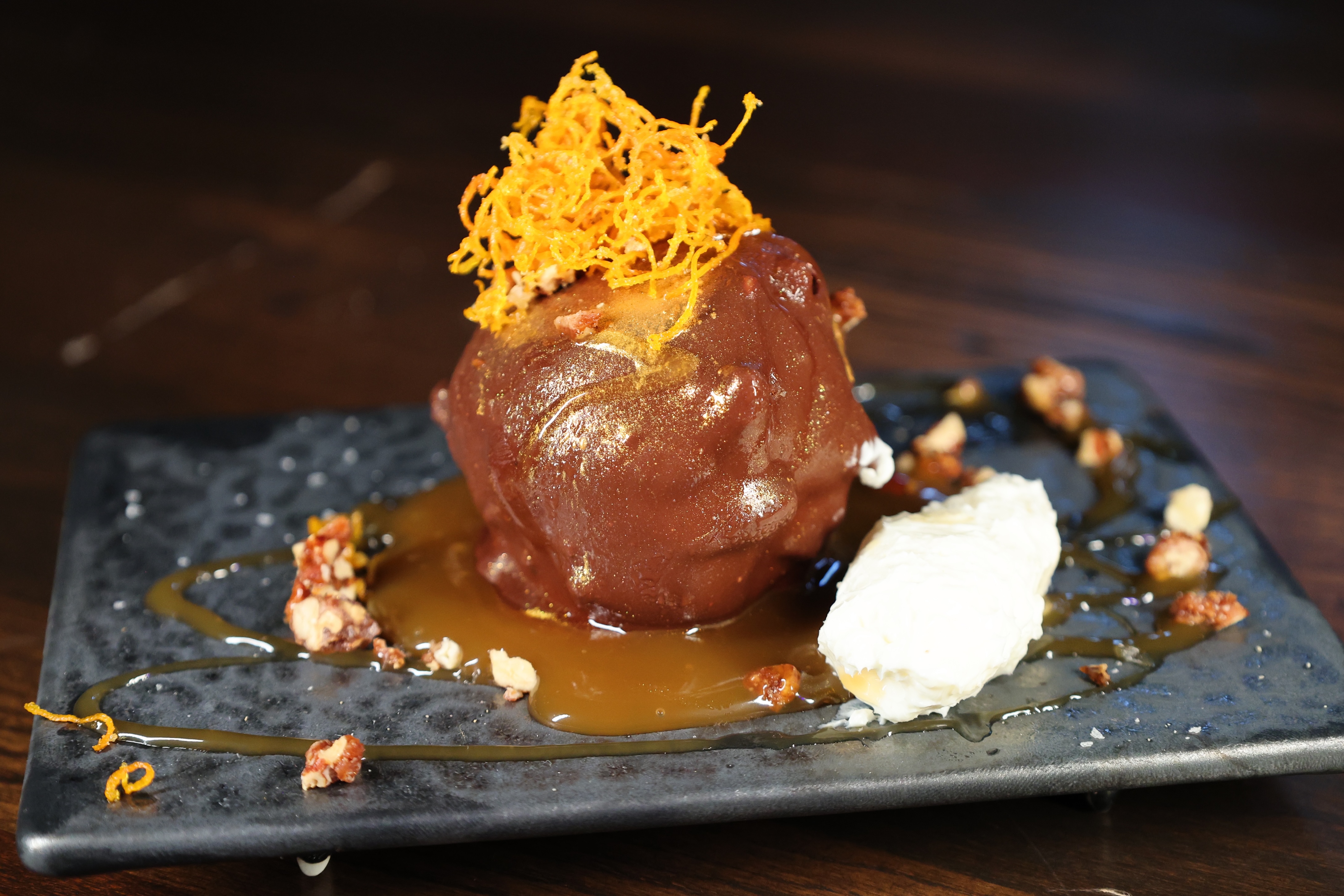 A Bad Rabbit small plate, shot dark and close on marble.